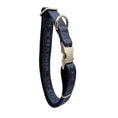 Load image into Gallery viewer, A dark navy blue dog collar with embossed lettering and gold-tone hardware