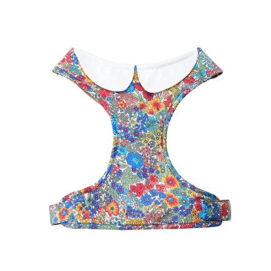 A colorful floral pet harness with a white collar, shown from the back on a white background.