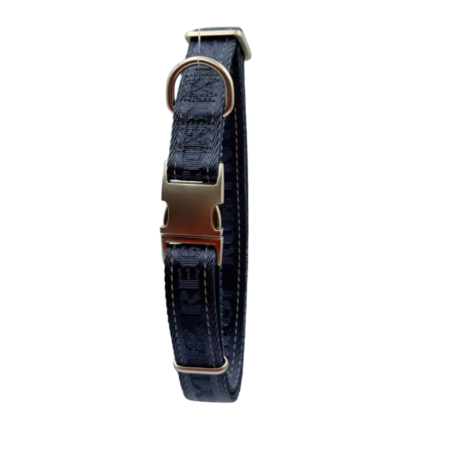 A dark navy blue woven dog collar with gold-tone hardware