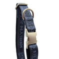Load image into Gallery viewer, A close-up of a dark blue patterned dog collar with a silver-tone metal buckle and D-ring
