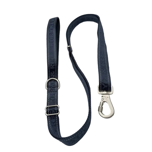 A dark navy blue leather dog leash with silver metal hardware, including a D-ring and a heavy-duty hook clasp, 