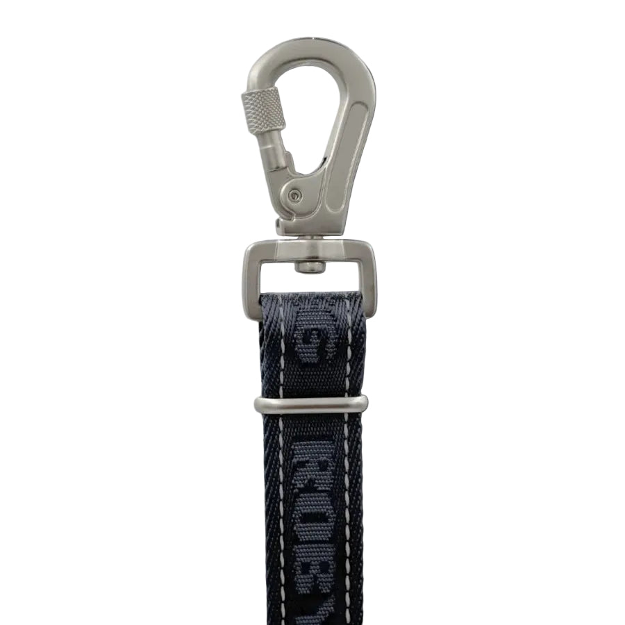 A close-up studio shot of a black woven strap with white stitching and a silver metal swivel clasp