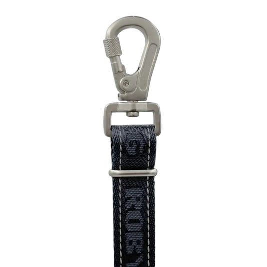 A close-up studio shot of a black woven strap with white stitching and a silver metal swivel clasp